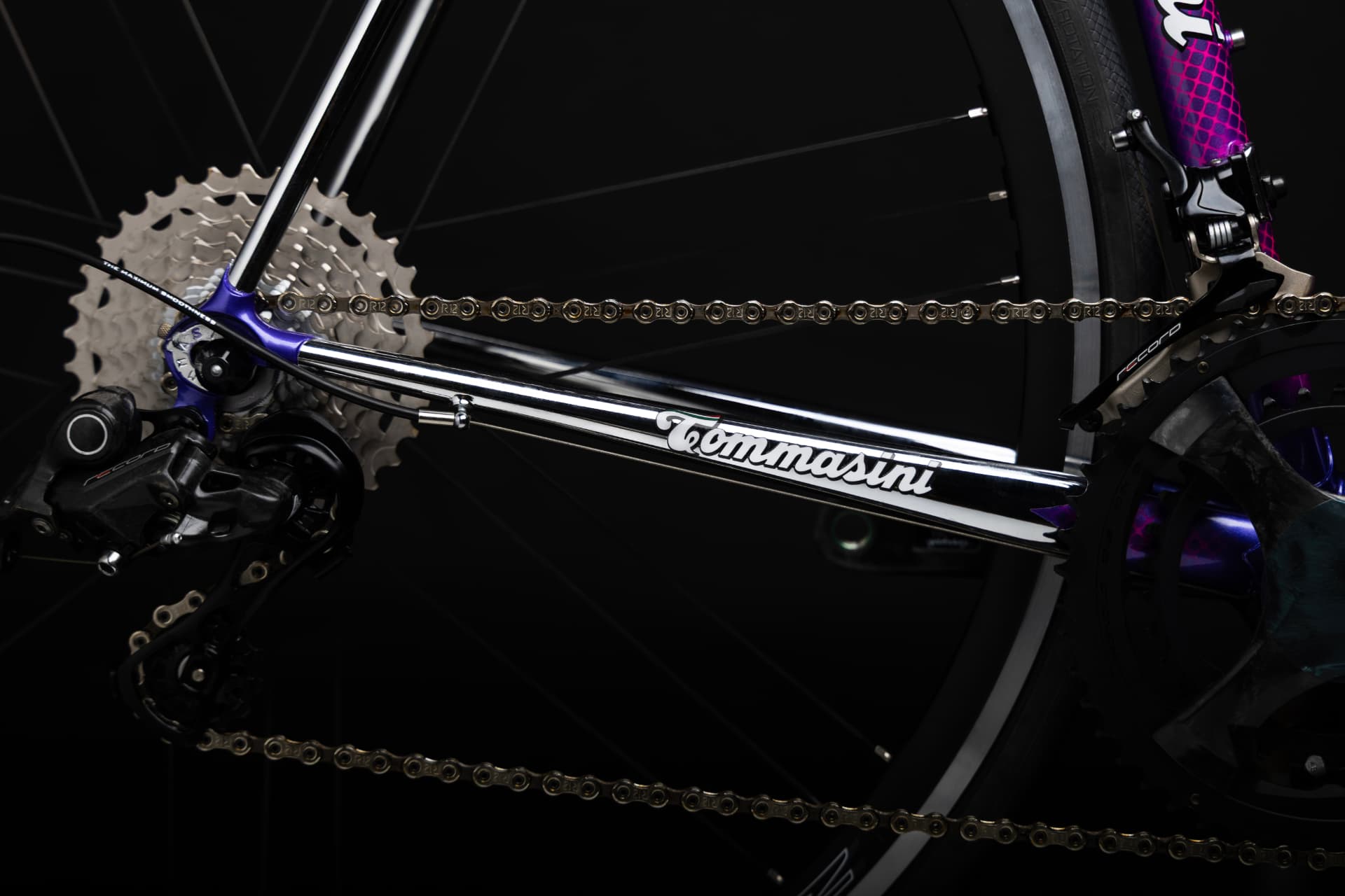 Close-up of the Tommasini Tecno rear dropout and cassette with the Tommasini signature on the chainstay