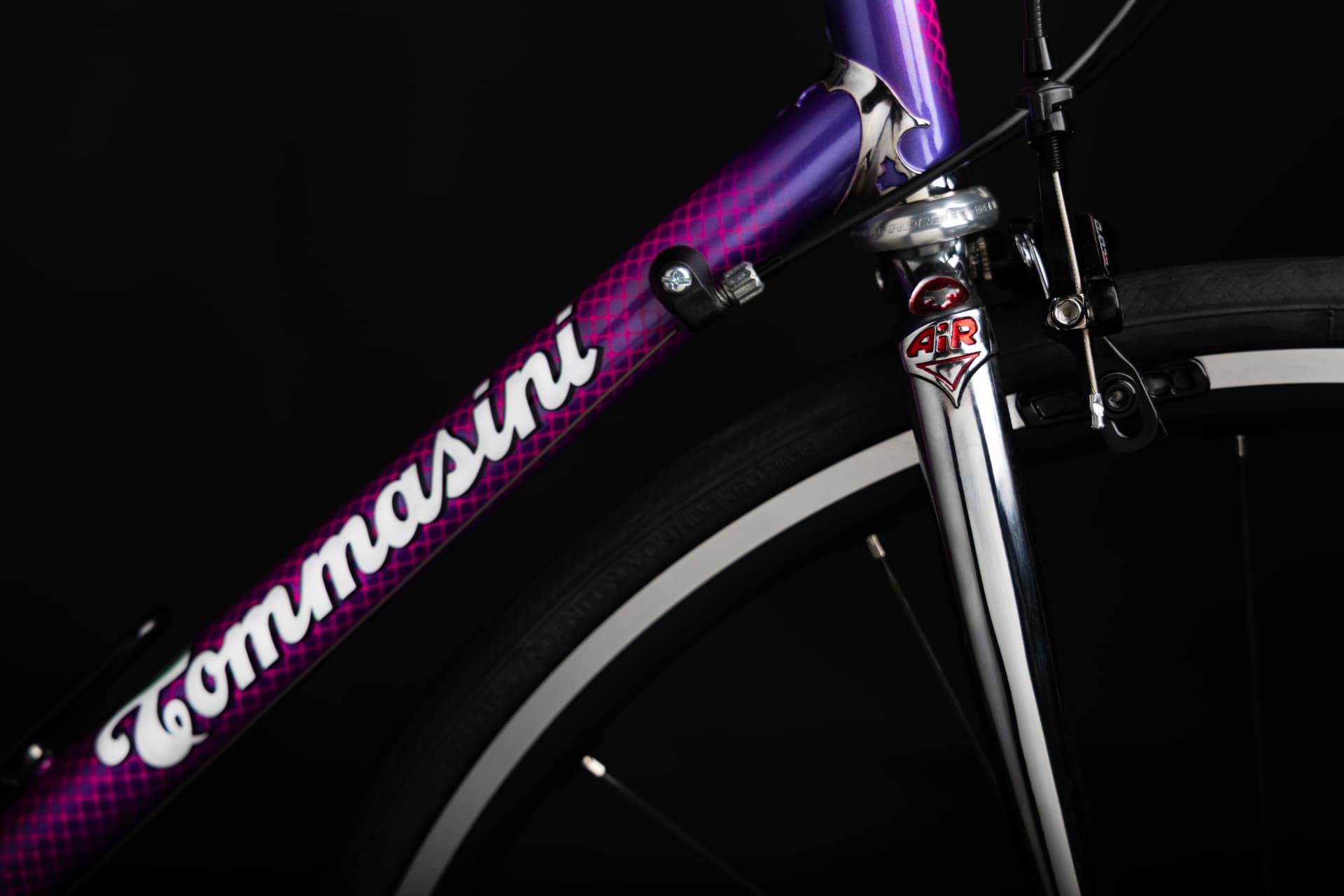 Angled view of the Tecno head tube and chromed AiR fork crown with the Tommasini down tube script
