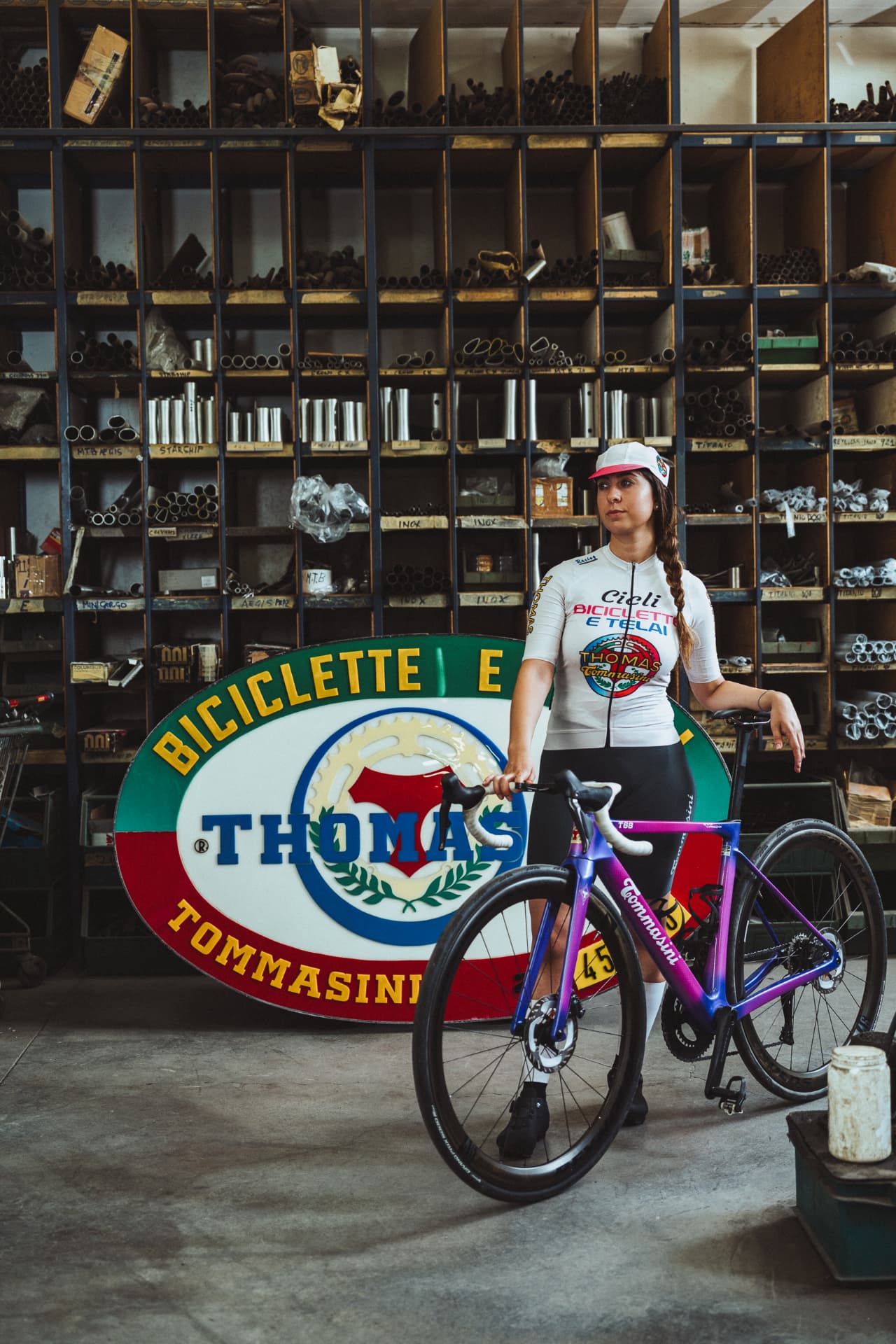 Riders in Tommasini apparel inside the frame workshop in Grosseto
